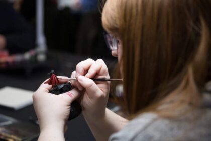 Woman painting a Warhammer model