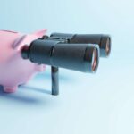 piggy bank, searching with binoculars