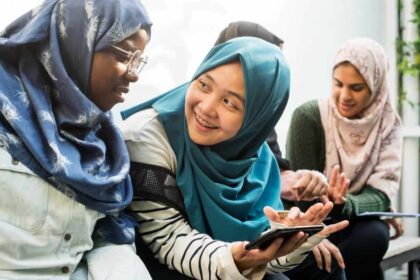 Diverse group of students using mobile phone