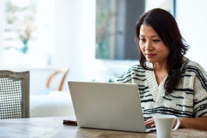 Woman using laptop and working from home